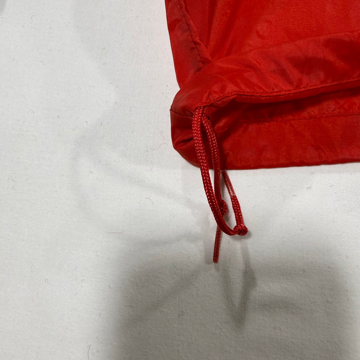 Red drawstring on bottom