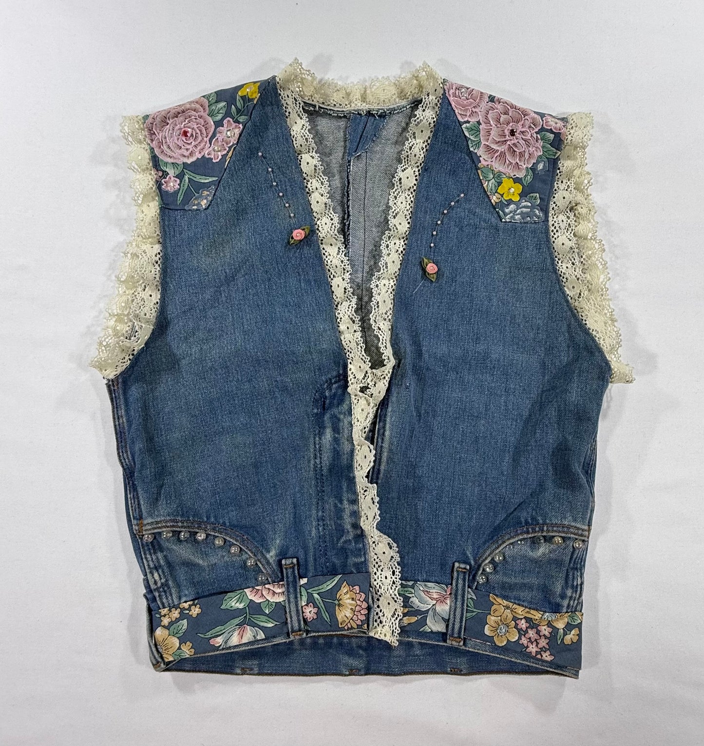 Vintage upcycled western denim vest with floral patches, custom lace trim, rhinestones and pearl accents - Front