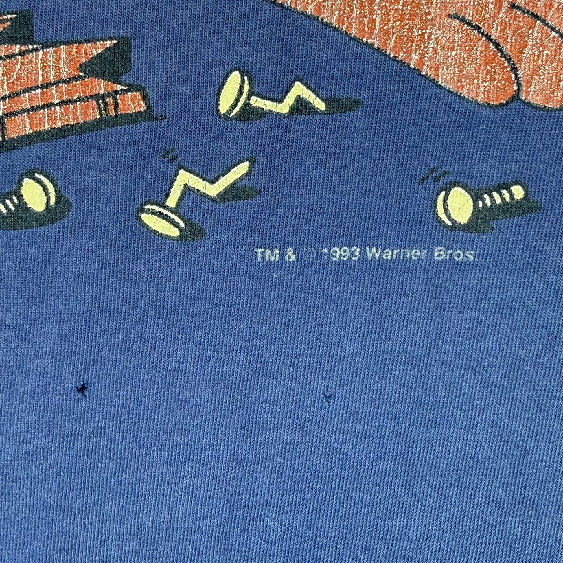 Small holes and TM & R 1993 Warner Bros printed text