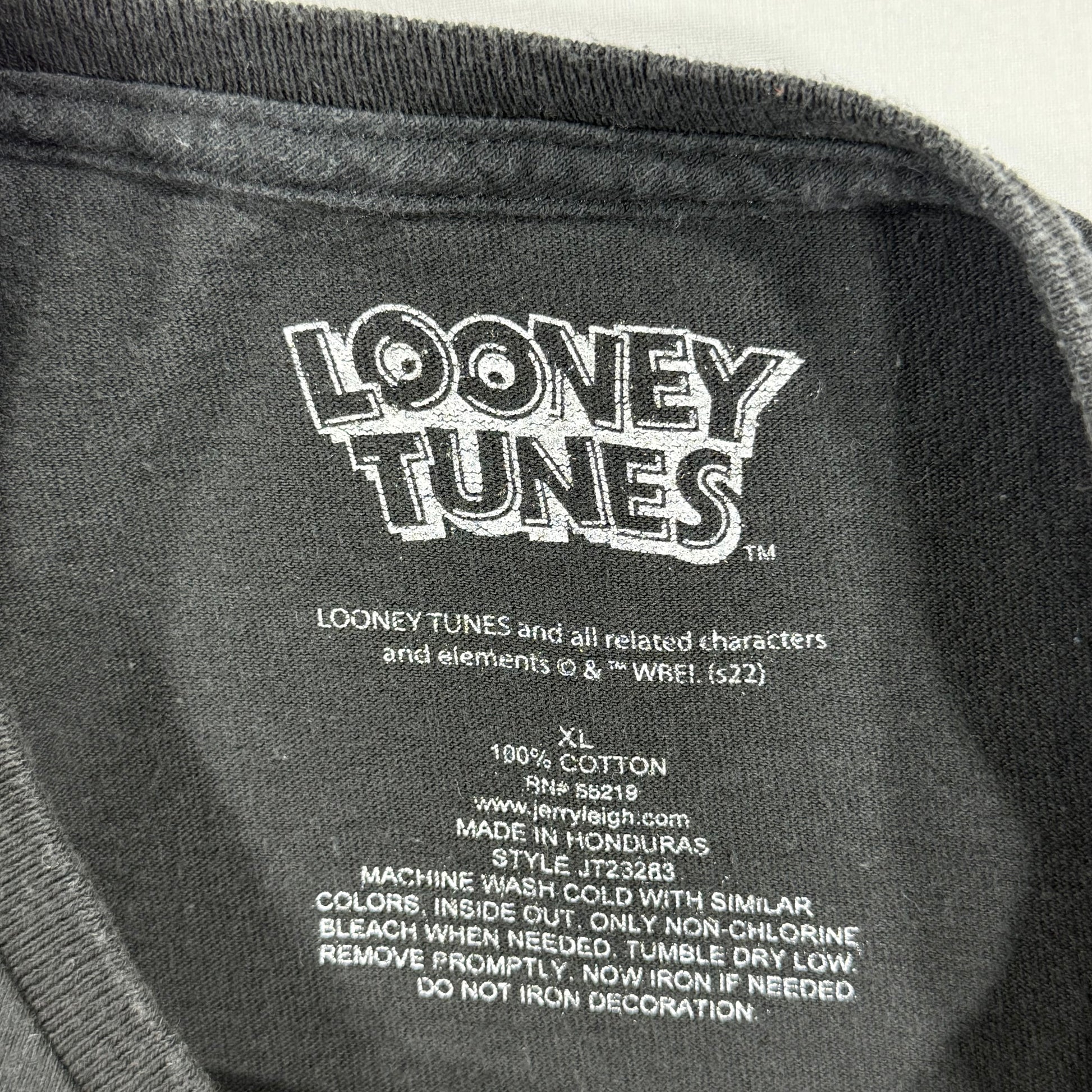 Looney Tunes label on a dark fabric background