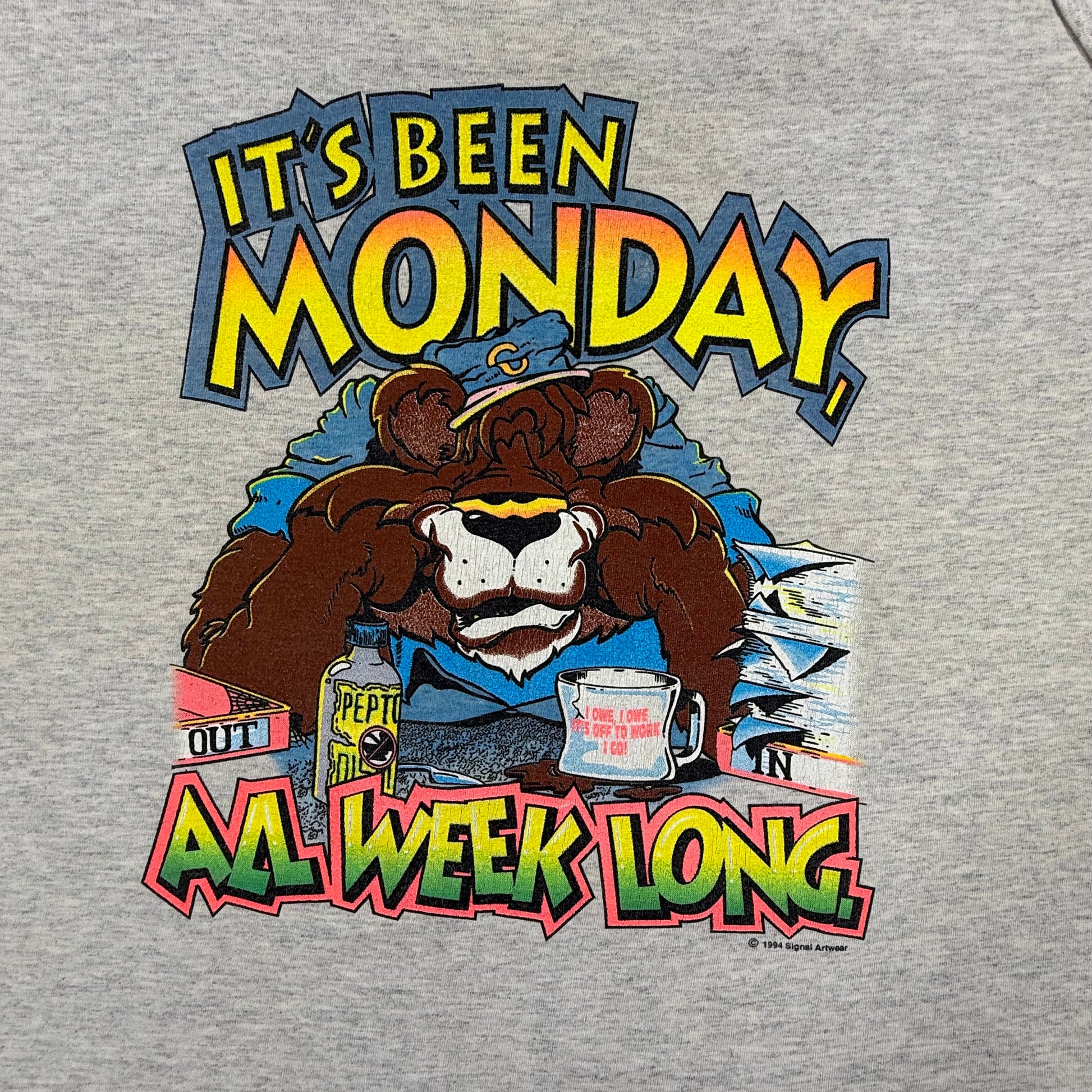 Gray sweatshirt with a cartoon bear and colorful text graphic on a gray background
