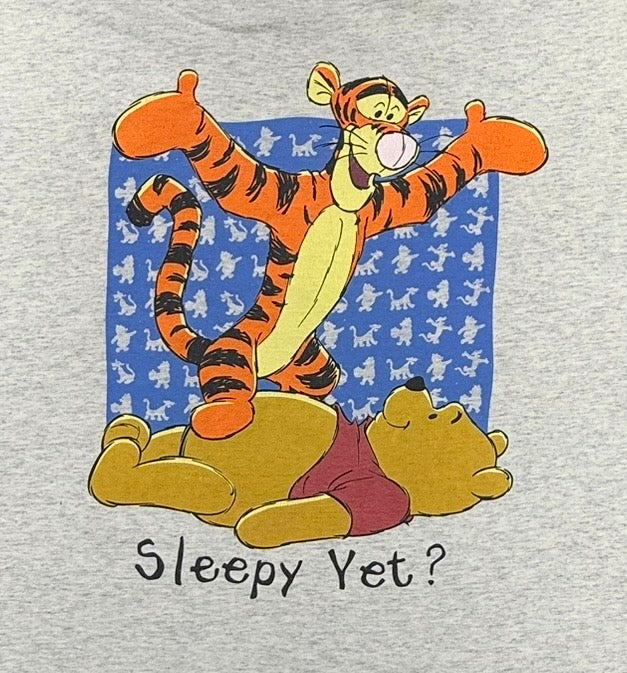 Disney Winnie the Pooh and Tigger characters graphic print with printed text "Sleepy Yet?"  